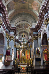 Fototapeta na wymiar interior of a Catholic temple with paintings and ornaments