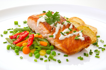 Salmon Steak with Vegetables and fried potatoes.