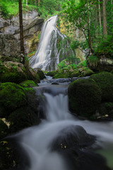 river with a waterfall in the background