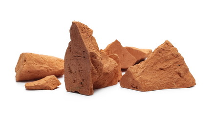 Shattered, broken bricks isolated on white background