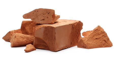 Shattered, broken bricks isolated on white background