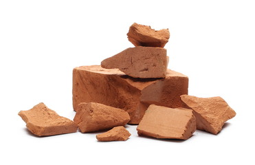 Shattered, broken bricks isolated on white background