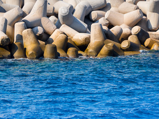 Obraz premium Huge concrete tetrapods near marina on Crete, Greece