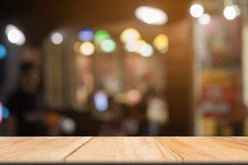 Wooden table of brown in front blurred background, use for presentation product and advertising