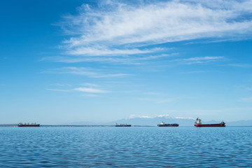 Cargo ships at the horizon