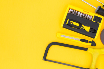 DIY tool set. Tools lie on a yellow background. There is a place for text.