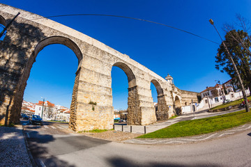 an ancient aquiduct in a sunny day