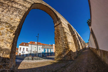 an ancient aquiduct in a sunny day