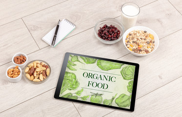 Fresh food on the table with a tablet PC.