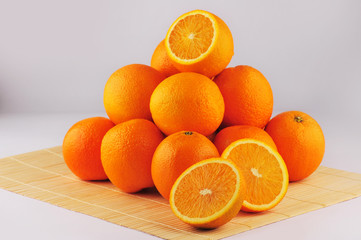 Fresh oranges isolated on the gray background
