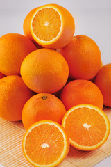 Fresh oranges isolated on the gray background