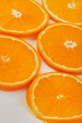 Fresh slised oranges isolated on the gray background