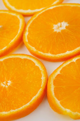 Fresh slised oranges isolated on the gray background