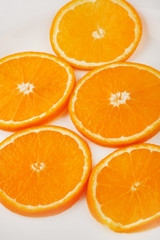 Fresh slised oranges isolated on the gray background
