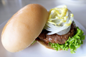 Closeup Photo of Homemade Burger Buns on a White Plate