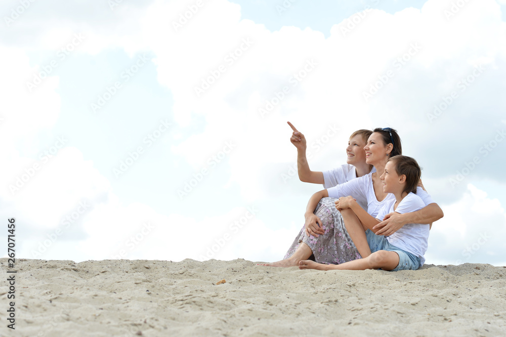 Poster portrait of happy family on beach in summer day