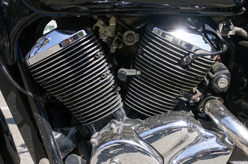 Chrome Cylinders Motorcycle Engine with Light Reflection