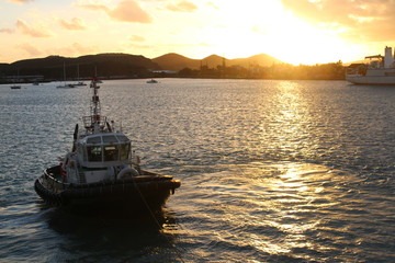 sunset with a tug boat