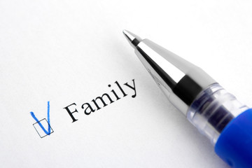 Family. Filling in the questionnaire, documents. The checkboxes are filled with a black pen on a white background. Questionnaire, survey.