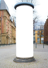 empty advertising pillar in a city with free copy space, promotion mockup © Thomas Bethge