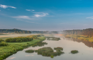 Fototapeta na wymiar River Venta, Latvia, Kurzeme. morning light plays with fog