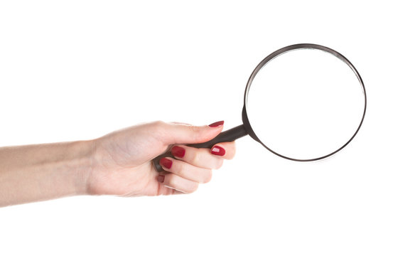 Female Hand Holding Magnifying Glass Isolated On White Background.