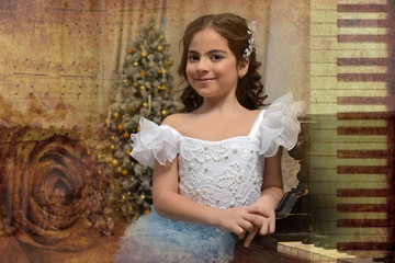 girl young princess in white with a blue dress and a barrette in black hair curls at the piano