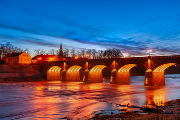 historical brick bridge over venta river in kuldiga, latvia - obrazy, fototapety, plakaty