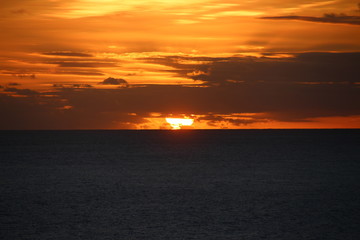 sunset behind the clouds