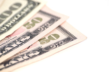 Money on white background with space for copy on the right, isolate, closeup