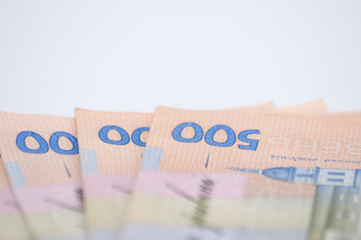 Ukrainian hryvnia money on a white background, close-up, copy space