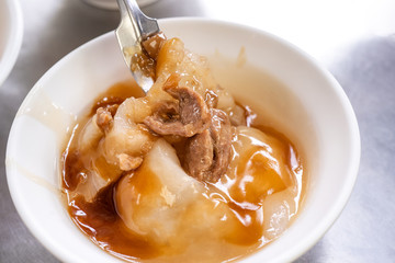 Bawan (Ba wan), taiwanese meatball delicacy, delicious street food, fried starch wrapped round shaped dumpling with pork inside, close up, copy space