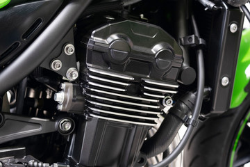 Fototapeta na wymiar Clean inline Four Motorcycle Engine, Big Street Cafe Bike with Full Horsepower