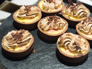 Dessert concept, sweet dessert in cafe, Cake on black wooden.