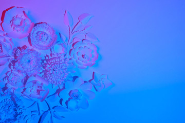 White paper flowers made of white paper on white background.