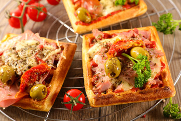 waflle with tomato sauce, ham and olive