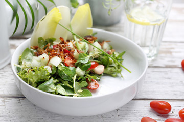 Healthy natural food. Salad with green vegetables, vitamins on the plate.