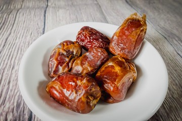 A Tamar (Dates)  against wooden background