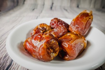 A Tamar (Dates)  against wooden background