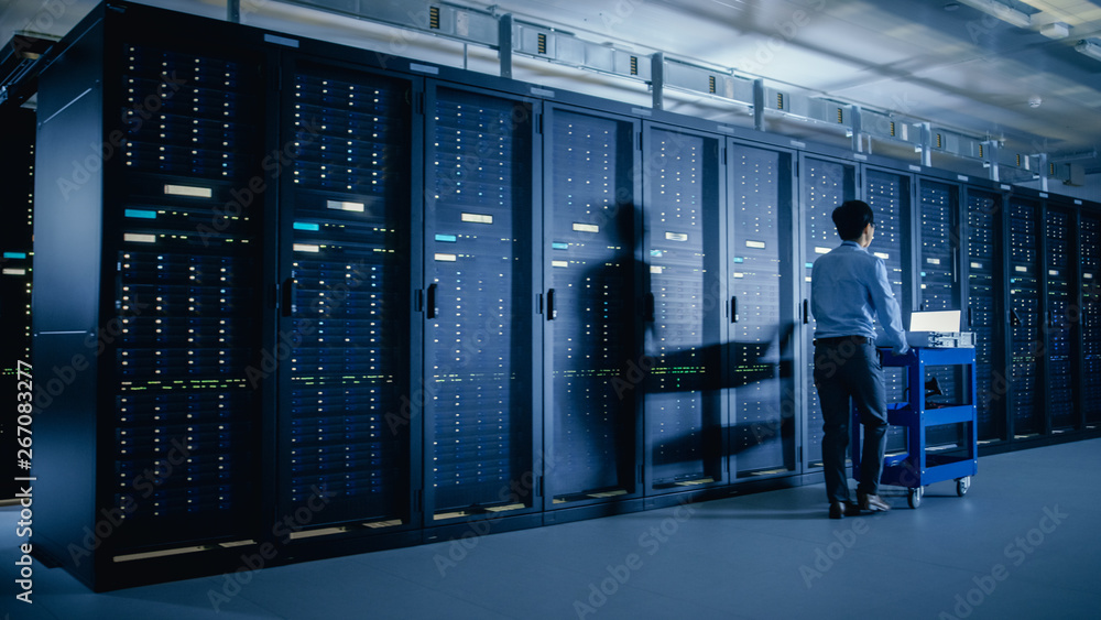 Aufkleber In the Modern Data Center: IT Engineer Doing Maintenance and Diagnostics. Pushes Cart alongside Server Racks. Planned System Equipment Update and Maintanence.