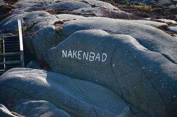 Word written on a mountain in the Swedish archipelago, Translation: Skinny dipping