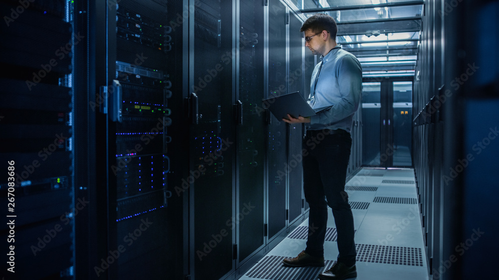Aufkleber In Data Center IT Engineer Stands Before Working Server Rack Doing Routine Maintenance Check and Diagnostics Using Laptop. Concept of Cloud Computing, Artificial Intelligence, Supercomputer