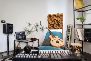 Home music studio equipped with various instruments.