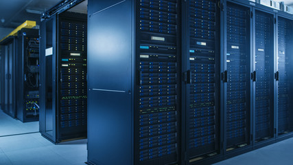 Shot of Modern Data Center With Multiple Rows of Operational Server Racks. Modern High-Tech...
