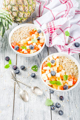 Breakfast oatmeal with tropical fruits