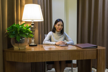 asian girl like working woman, getting an interview on her desk