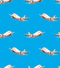 Seamless repeating pattern of blue clear sky and planes with a yellow tail and white wings flying in different directions and carrying cargo and passengers