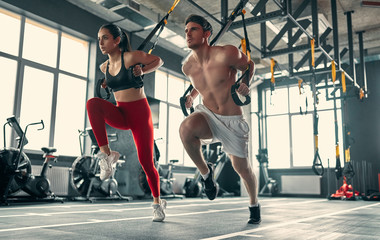 Sporty couple in gym
