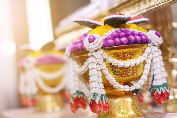 Beautiful flowers decoration on Engagement gold bowl for Thai engagement ceremony.Thai wedding culture tradition