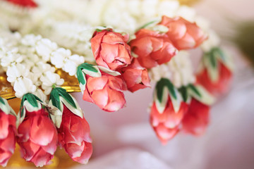 Flower garlands on a gold tray in tradition Thai wedding ceremony day. Jasmine garland